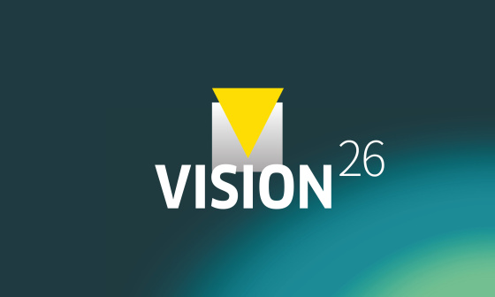 청록색 배경에 ‘VISION26’이라는 문구가 적힌 그래픽.
